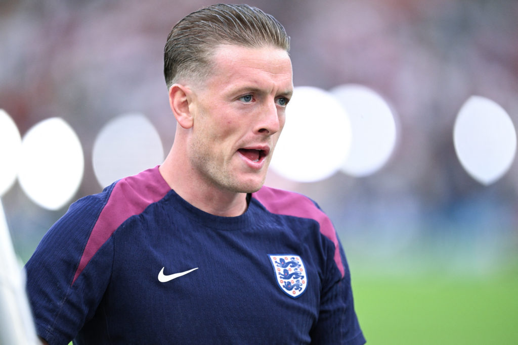 England's goalkeeper #01 Jordan Pickford warms up ahead of the UEFA Euro 2024 final football match between Spain and England at the Olympiastadion ...