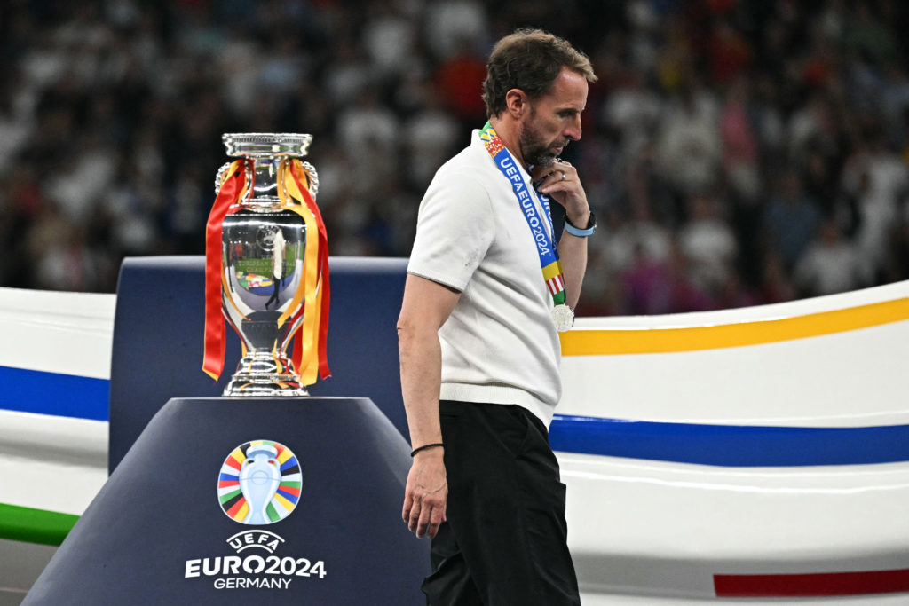 England's head coach Gareth Southgate walks with his silver medal past to the trophy after  the UEFA Euro 2024 final football match between Spain a...