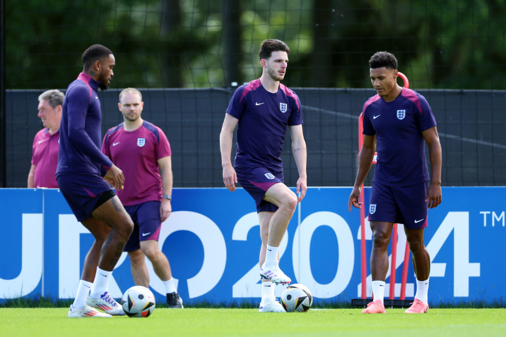 Declan Rice of England warms up with teammates Ivan Toney and Ollie Watkins during the England Training Session ahead of the UEFA EURO 2024 final m...