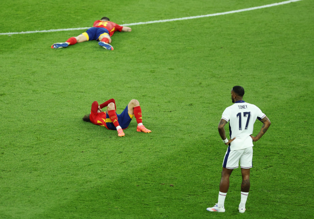 Ivan Toney of England shows dejection as Fabian Ruiz and Marc Cucurella of Spain react after the UEFA EURO 2024 final match between Spain and Engla...