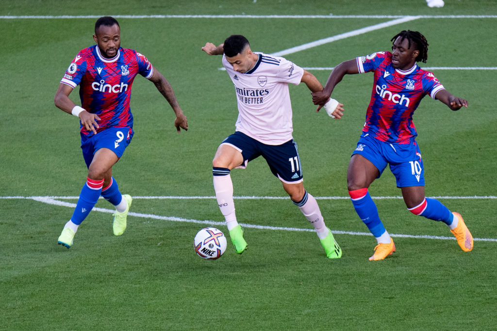 Gabriel Martinelli of Arsenal FC fights for the ball with Eberechi Eze and Jordan Ayew of Crystal Palace in action during the Premier League match ...