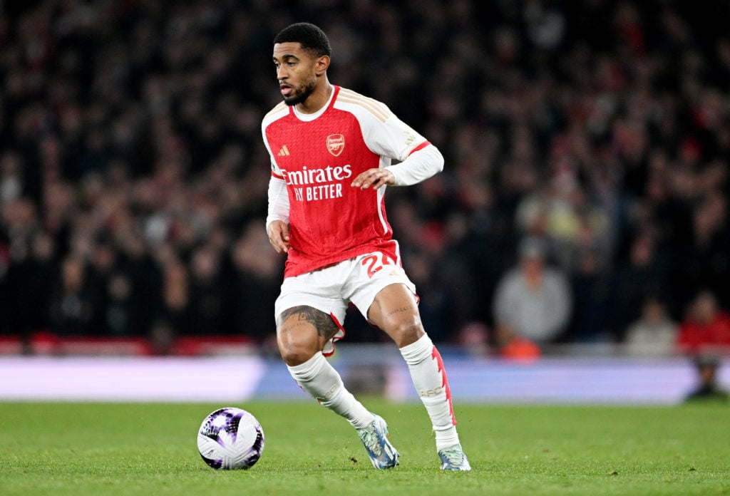 Reiss Nelson of Arsenal runs with the ball during the Premier League match between Arsenal FC and Brentford FC at Emirates Stadium on March 09, 202...