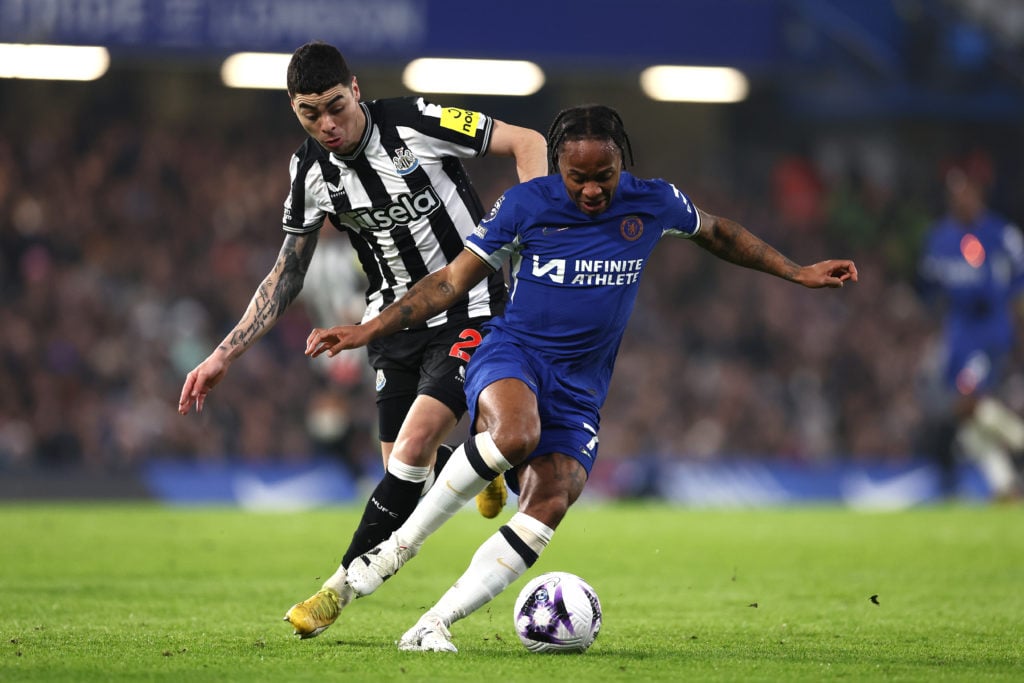 Raheem Sterling of Chelsea is tackled by Miguel Almiron of Newcastle United during the Premier League match between Chelsea FC and Newcastle United...