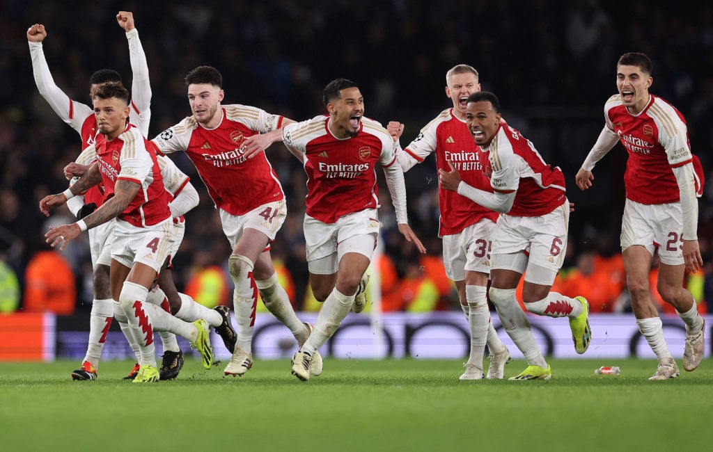 The players of Arsenal celebrate as David Raya of Arsenal (not pictured) makes the match-winning save from the fourth penalty from Galeno of FC Por...