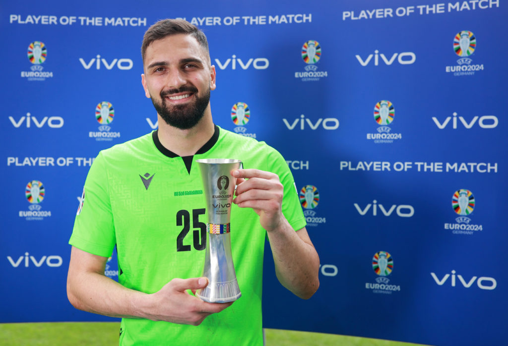 Giorgi Mamardashvili of Georgia poses for a photo with the Vivo Player of the Match award after the draw in the UEFA EURO 2024 group stage match be...