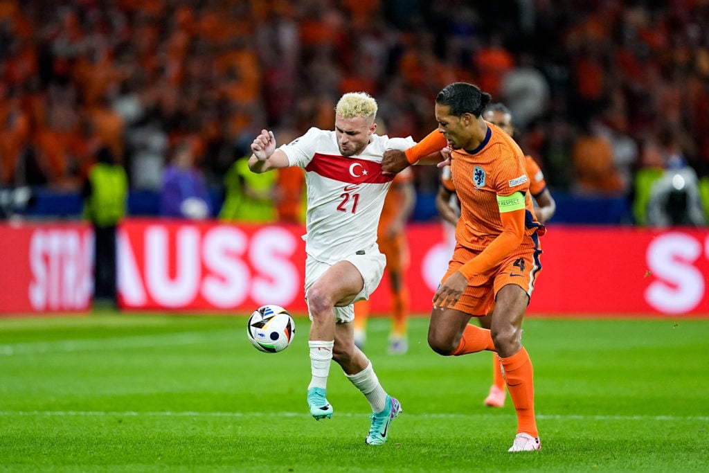 Baris Alper Yilmaz #21 of Turkiye (left) and Virgil van Dijk #4 of Netherlands battle for the ball during the UEFA EURO 2024 quarterfinal between T...