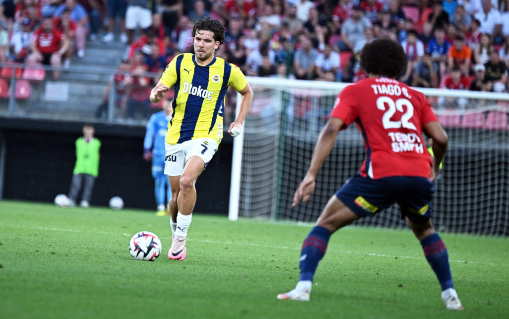 Ferdi Kadioglu (7) of Fenerbahce in action against Tiago Santos (22) of Lille during UEFA Champions League 3rd qualifying match between Lille and F...