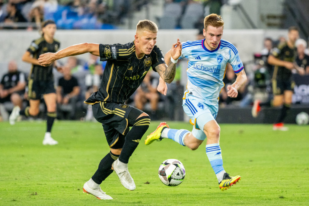 Mateusz Bogusz #19 of Los Angeles FC battles Connor Ronan #20 of Colorado Rapids during a Leagues Cup semi-final game between Los Angeles FC and Co...