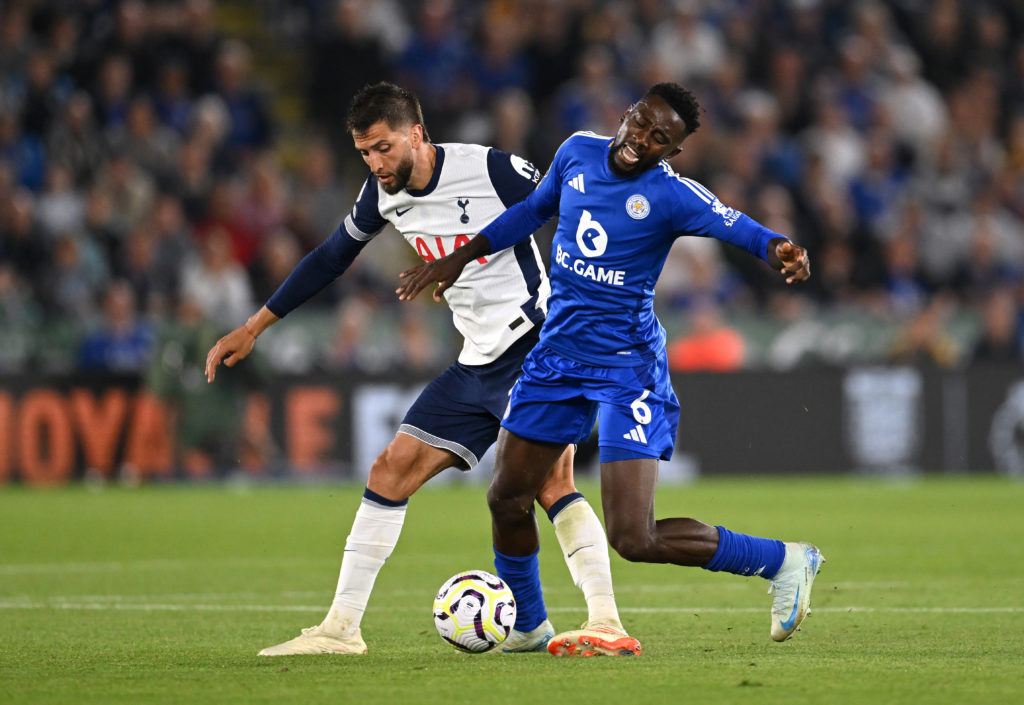 Wilfred Ndidi of Leicester City is challenged by Rodrigo Bentancur of Tottenham Hotspur during the Premier League match between Leicester City FC a...