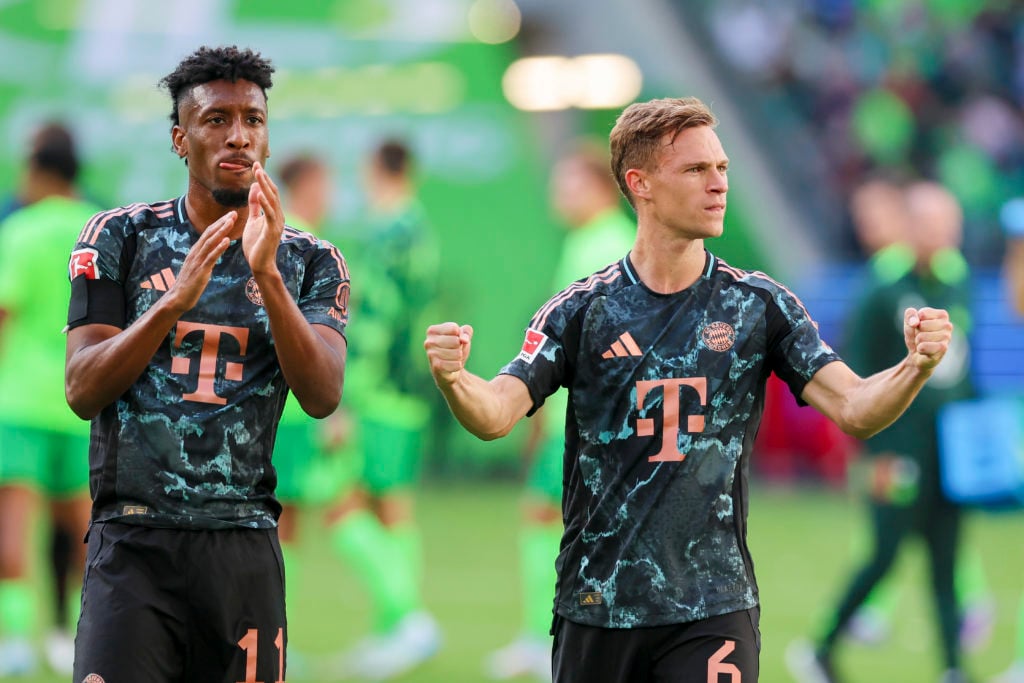 Kingsley Coman of Bayern Muenchen and Joshua Kimmich of Bayern Muenchen cheer during the Bundesliga match between VfL Wolfsburg and FC Bayern Münch...