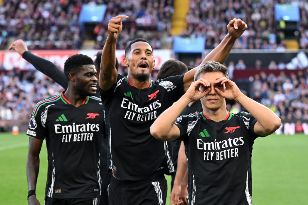 Leandro Trossard of Arsenal celebrates scoring his team's first goal with teammate William Saliba during the Premier League match between Aston Vil...