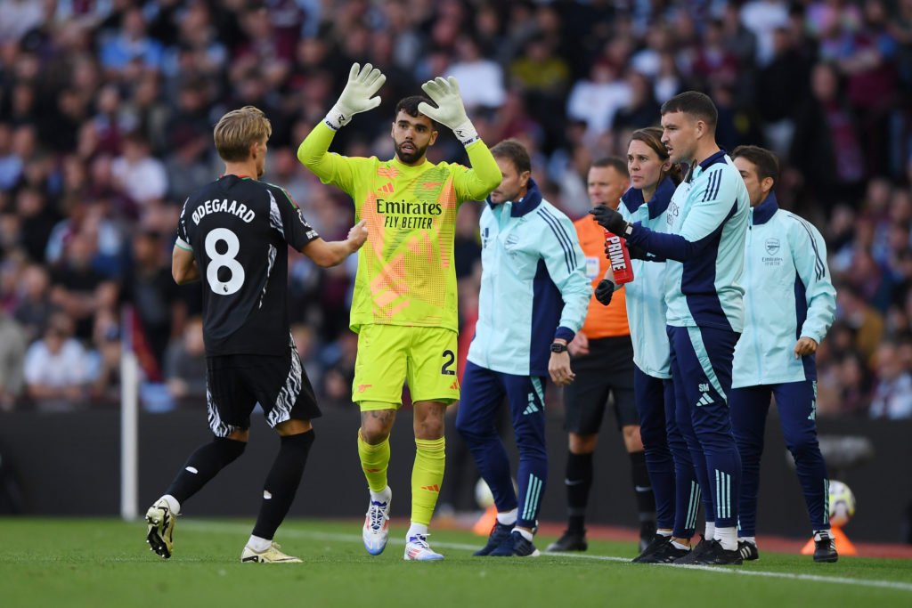 David Raya and Martin Odegaard of Arsenal celebrate after Leandro Trossard of Arsenal (not pictured) scores his team's first goal during the Premie...