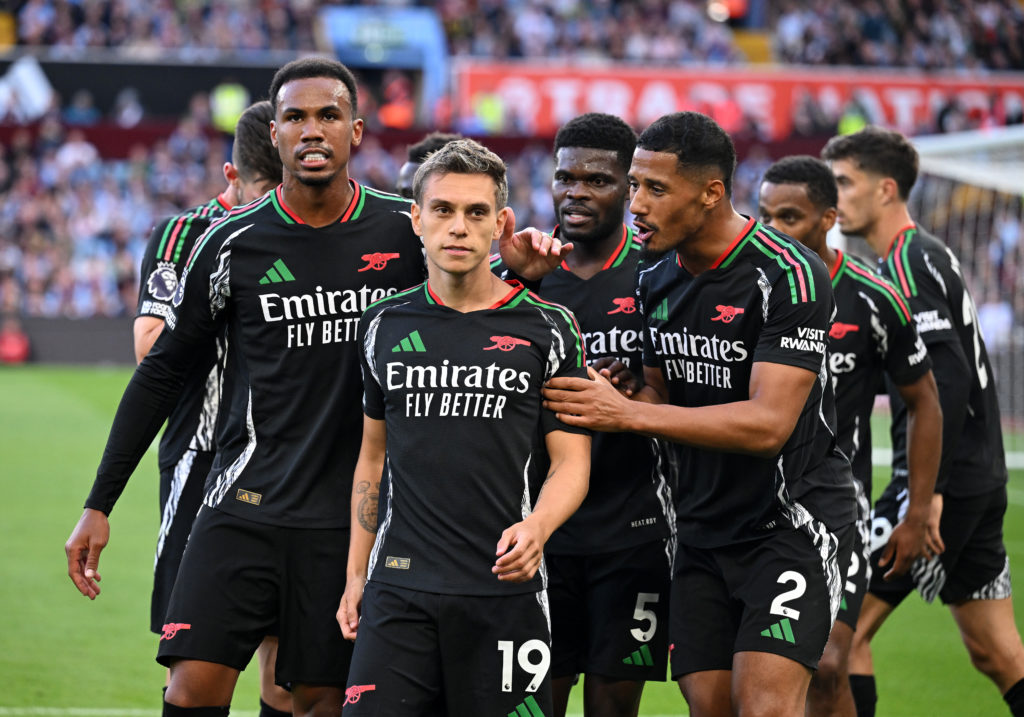 Leandro Trossard of Arsenal celebrates scoring his team's first goal with teammates  during the Premier League match between Aston Villa FC and Ars...