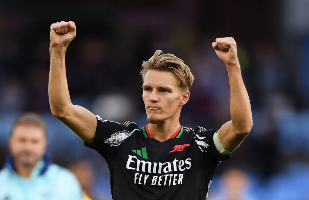 Martin Odegaard of Arsenal celebrates his team's victory after the Premier League match between Aston Villa FC and Arsenal FC at Villa Park on Augu...