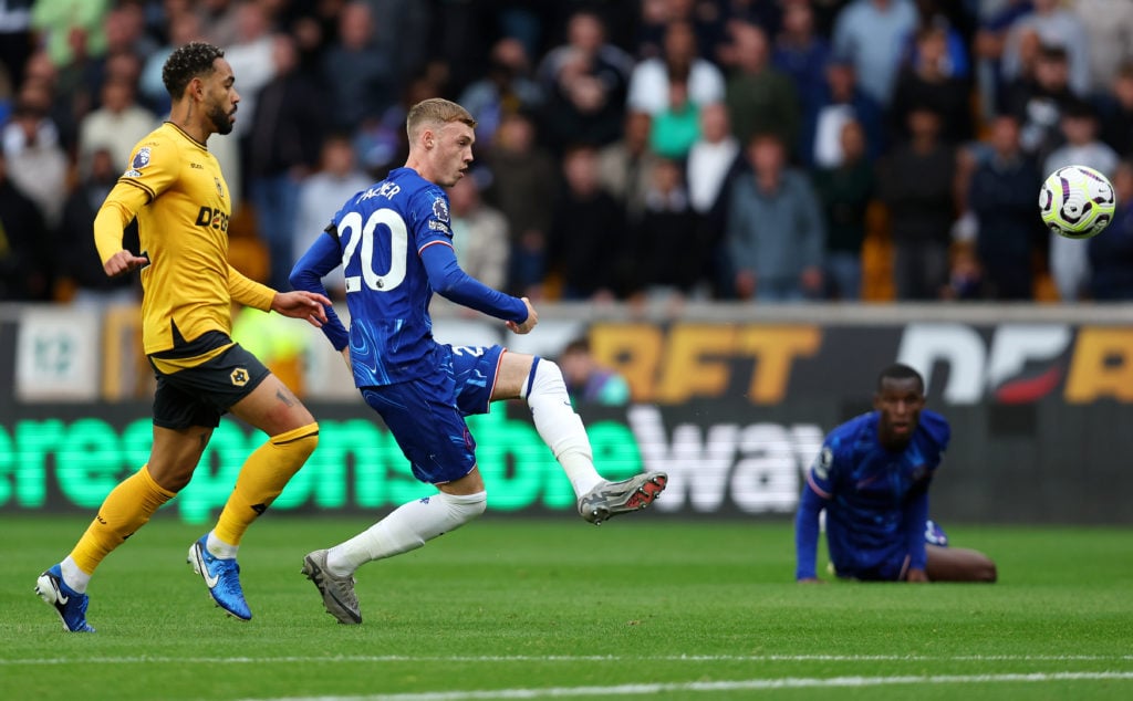 Cole Palmer of Chelsea scores his team's second goal during the Premier League match between Wolverhampton Wanderers FC and Chelsea FC at Molineux ...