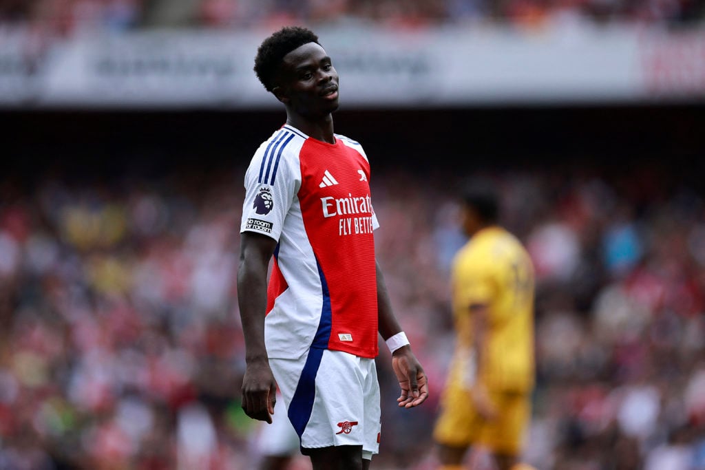 Arsenal's English midfielder #07 Bukayo Saka reacts during the English Premier League football match between Arsenal and Brighton and Hove Albion a...