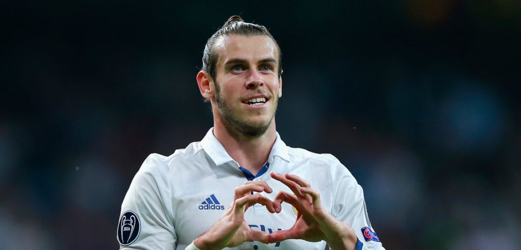 Gareth Bale of Real Madrid celebrates scoring his team's first goal during the UEFA Champions League Group F match between Real Madrid CF and Legia...