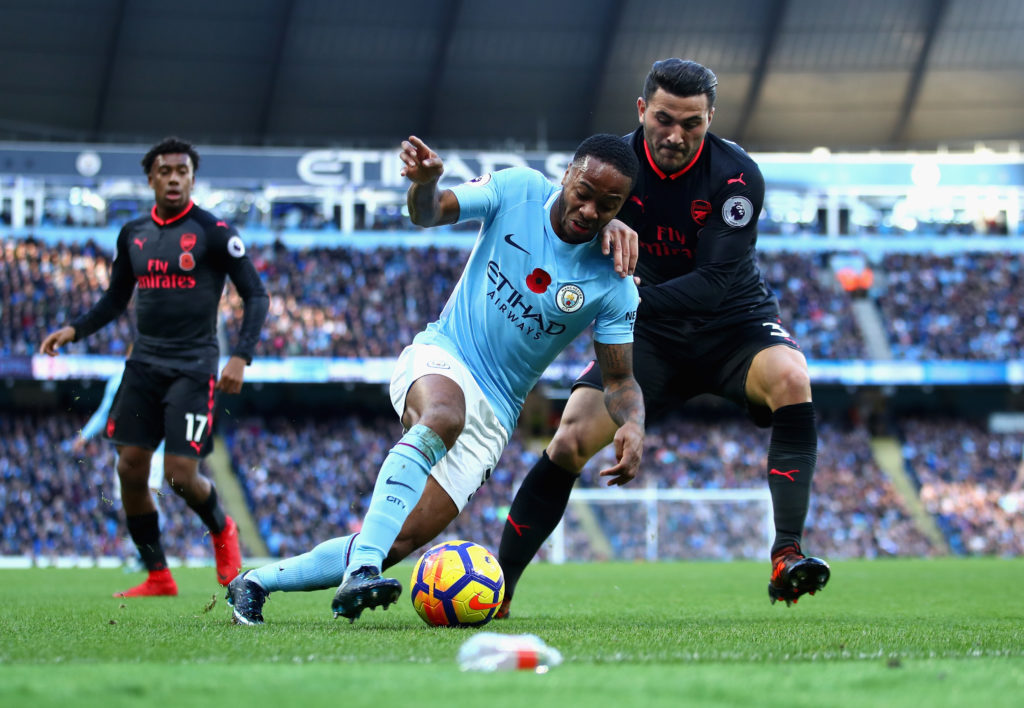 Sead Kolasinac of Arsenal and Raheem Sterling of Manchester City battle for possession during the Premier League match between Manchester City and ...