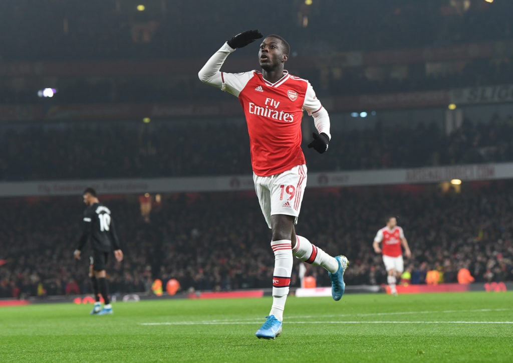 Nicolas Pepe celebrates scoring the 1st Arsenal goal during the Premier League match between Arsenal FC and Manchester United at Emirates Stadium o...