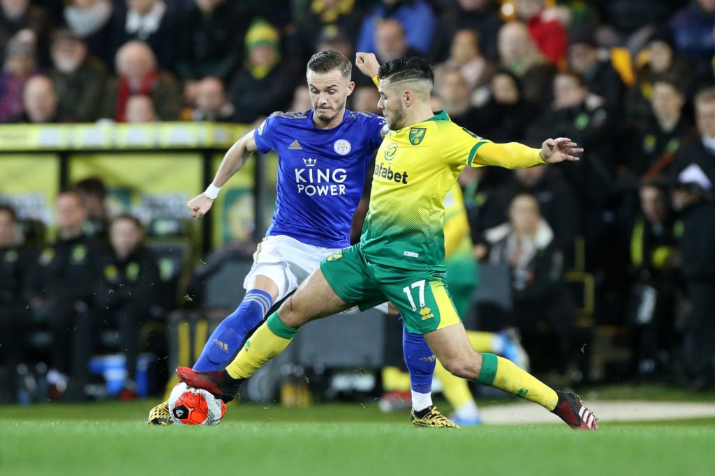 James Maddison of Leicester City in action with Emi Buendia of Norwich City during the Premier League match between Norwich City and Leicester City...