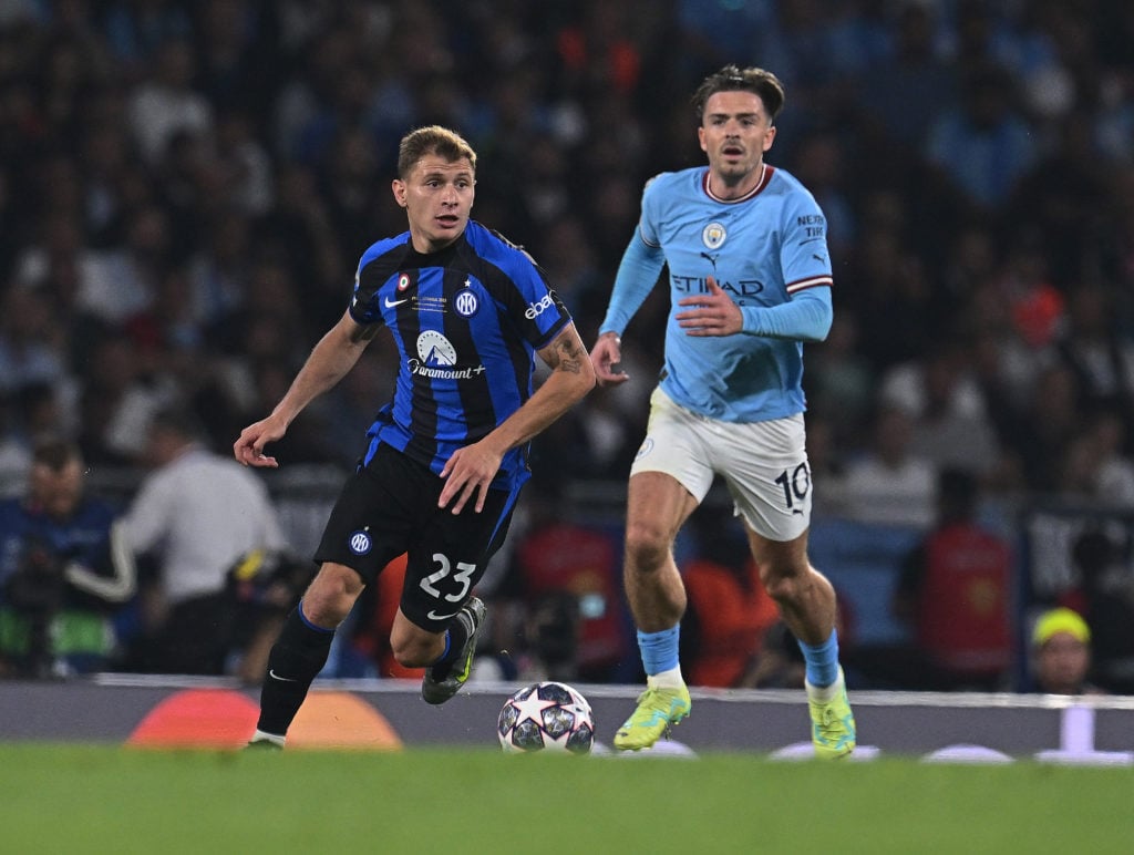 Nicolo Barella of FC Internazionale competes for the ball with Jack Grealish of Manchester City FC during the UEFA Champions League 2022/23 final m...