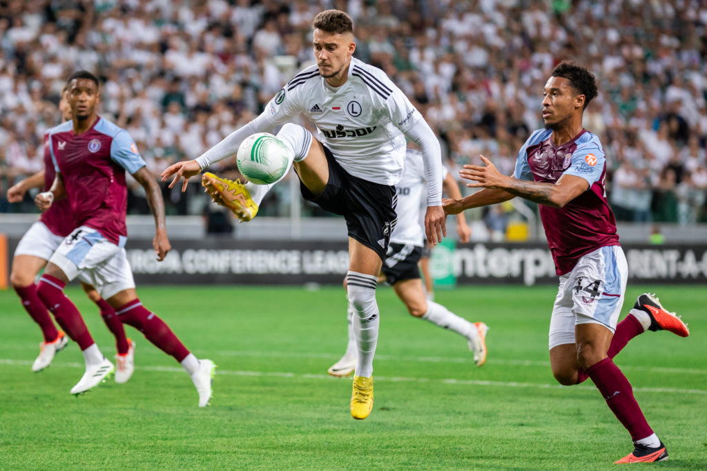 Ernest Muci (L) of Legia and Boubacar Kamara (R) of Aston VIlla are seen in action during the UEFA Europa Conference League group stage match betwe...