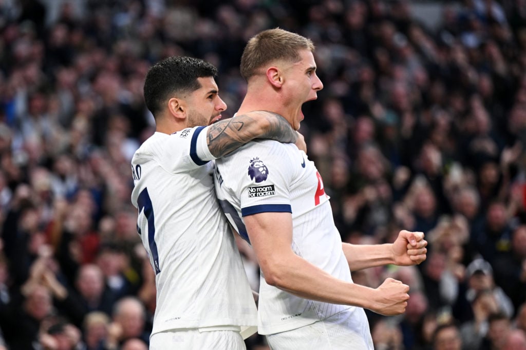 Micky van de Ven of Tottenham Hotspur (R) celebrates scoring his team's second goal with teammate Cristian Romero during the Premier League match b...