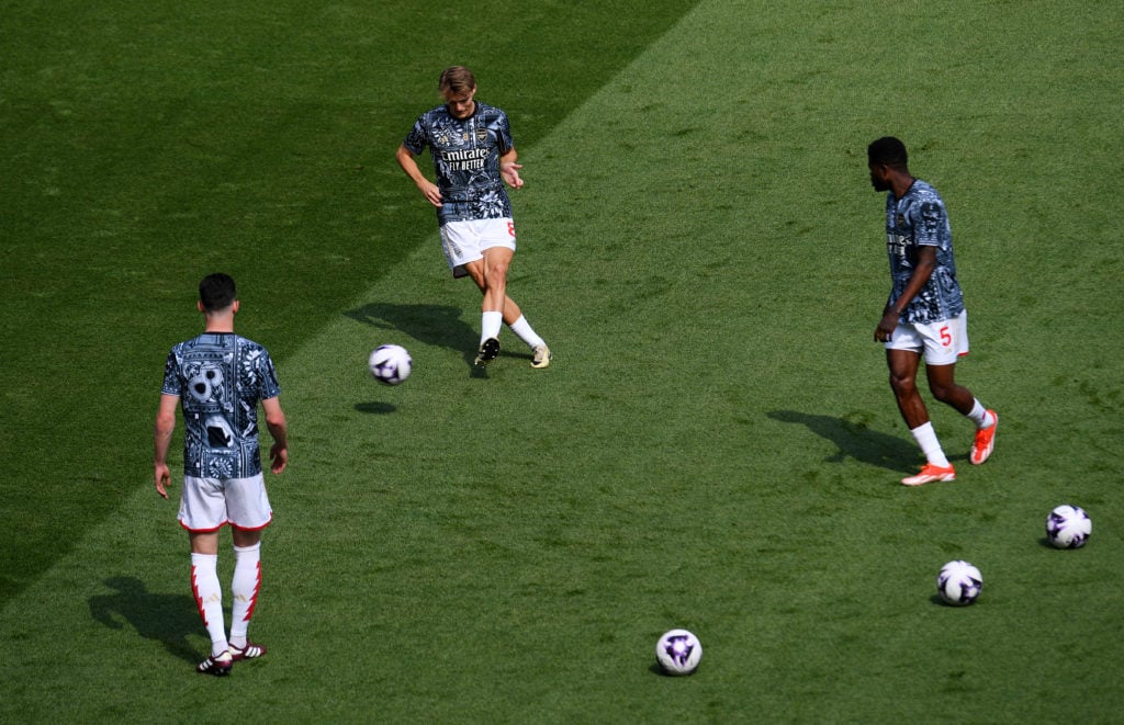 Martin Odegaard, Thomas Partey and Declan Rice of Arsenal warm up prior to the Premier League match between Arsenal FC and Everton FC at Emirates S...