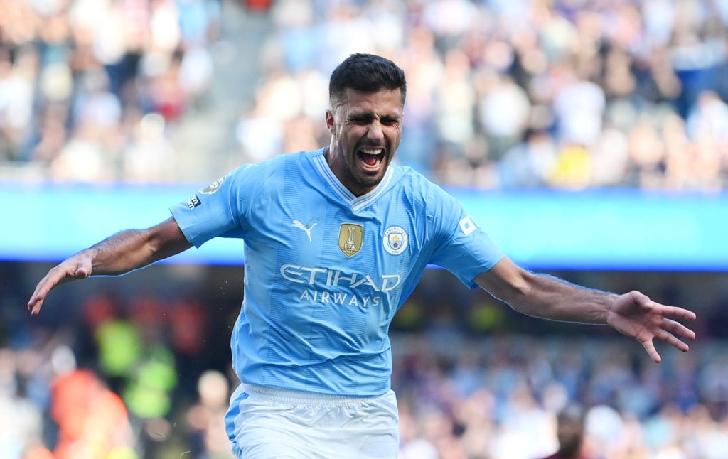 Rodri of Manchester City celebrates scoring his team's third goal during the Premier League match between Manchester City and West Ham United at Et...