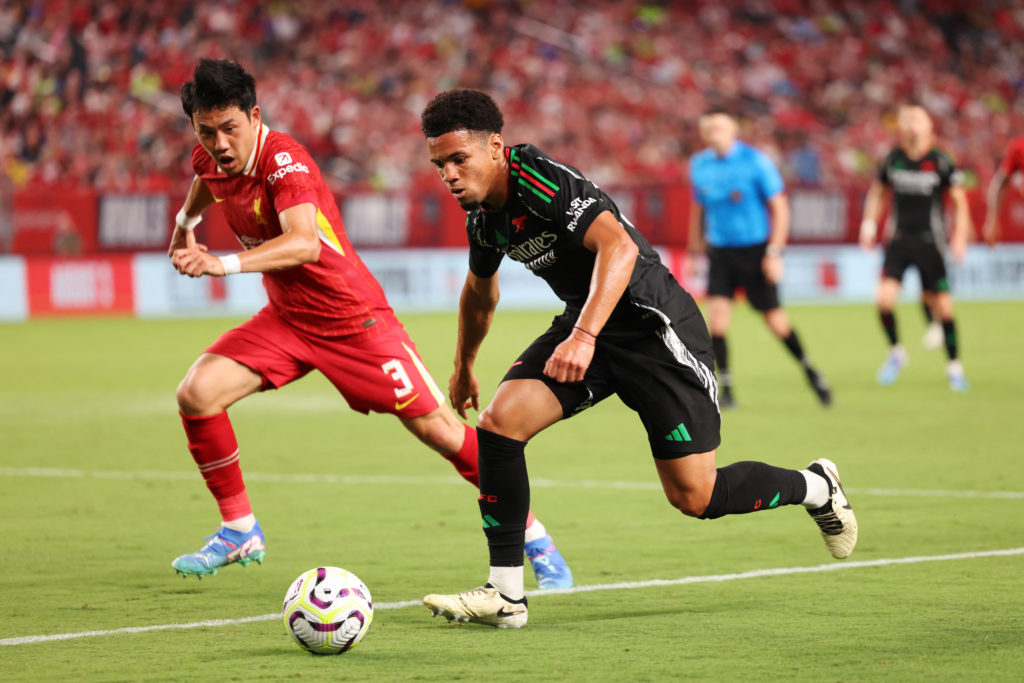 Liverpool's Japanese midfielder #03 Wataru Endo vies for the ball with Arsenal's English midfielder #53 Ethan Nwaneri (R) during the pre-season clu...