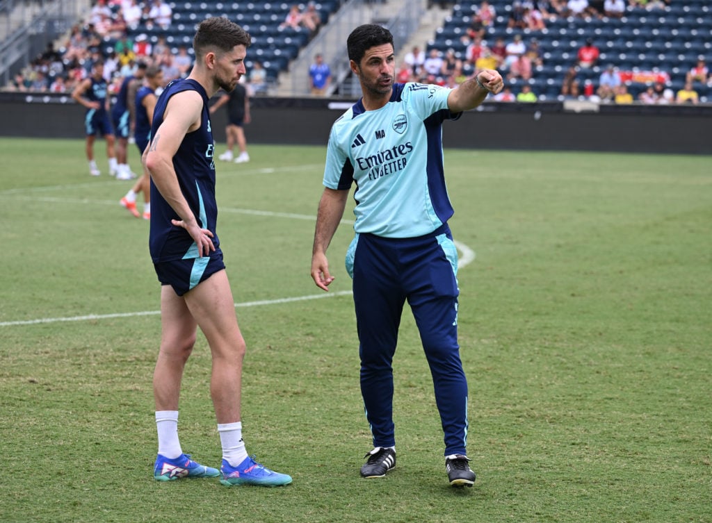 Arsenal manager Mikel Arteta talks to Jorginho  during a training session at Subaru Park on July 29, 2024 in Chester, Pennsylvania.