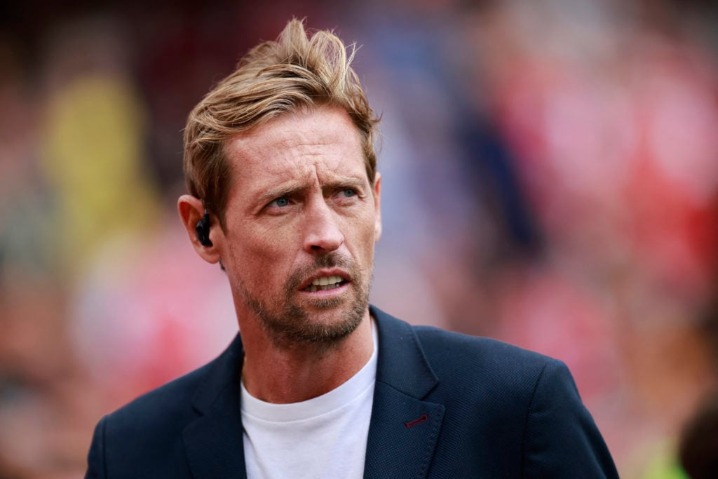 Former England footballer and TNT Sports presenter Peter Crouch waits for the start of the English Premier League football match between Arsenal an...