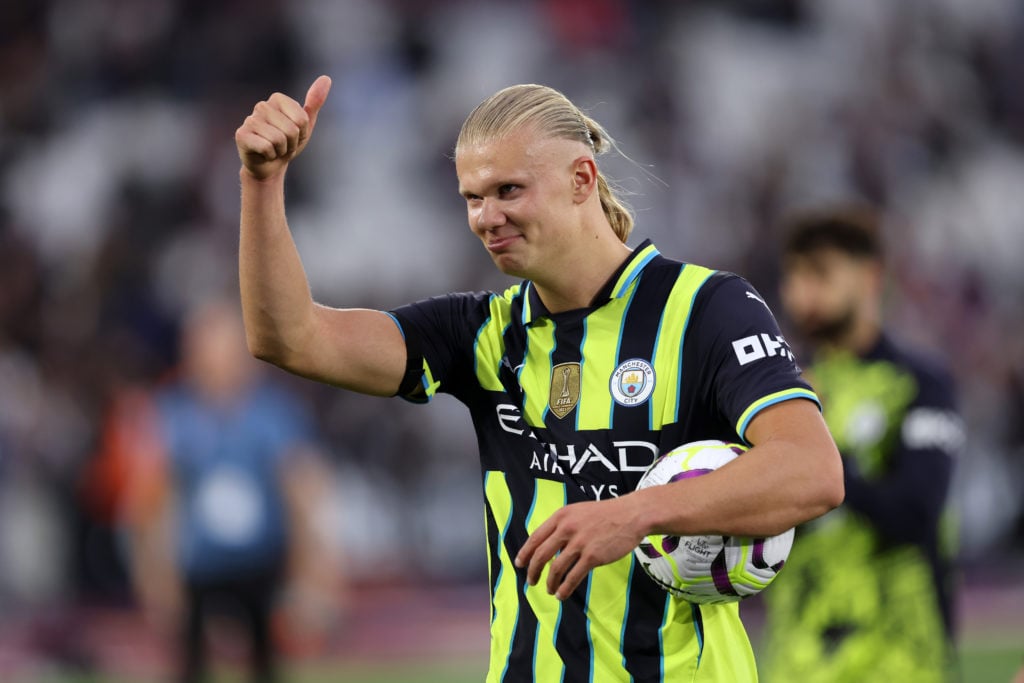 Erling Haaland of Manchester City celebrates with the match ball at the endafter scoring a hat-trick during the Premier League match between West H...