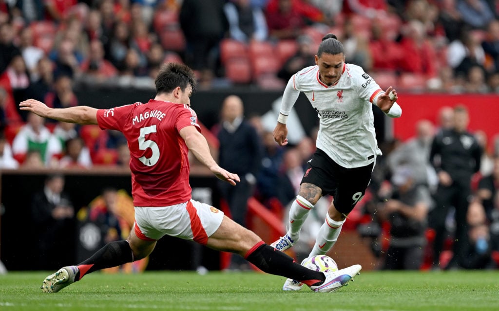 (THE SUN OUT, THE SUN. ON SUNDAY OUT) Darwin Nunez of Liverpool and Harry Maguire of Manchester United in action during the Premier League match be...