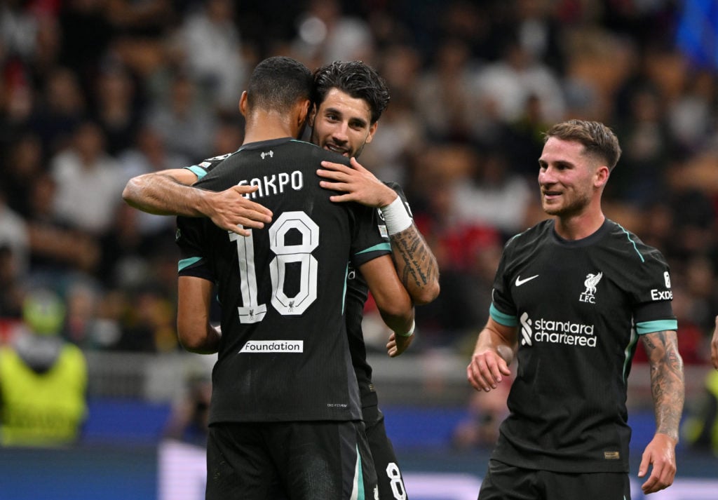 Dominik Szoboszlai of Liverpool FC celebrates goal with teammate Cody Gakpo during the UEFA Champions League 2024/25 League Phase MD1 match between...