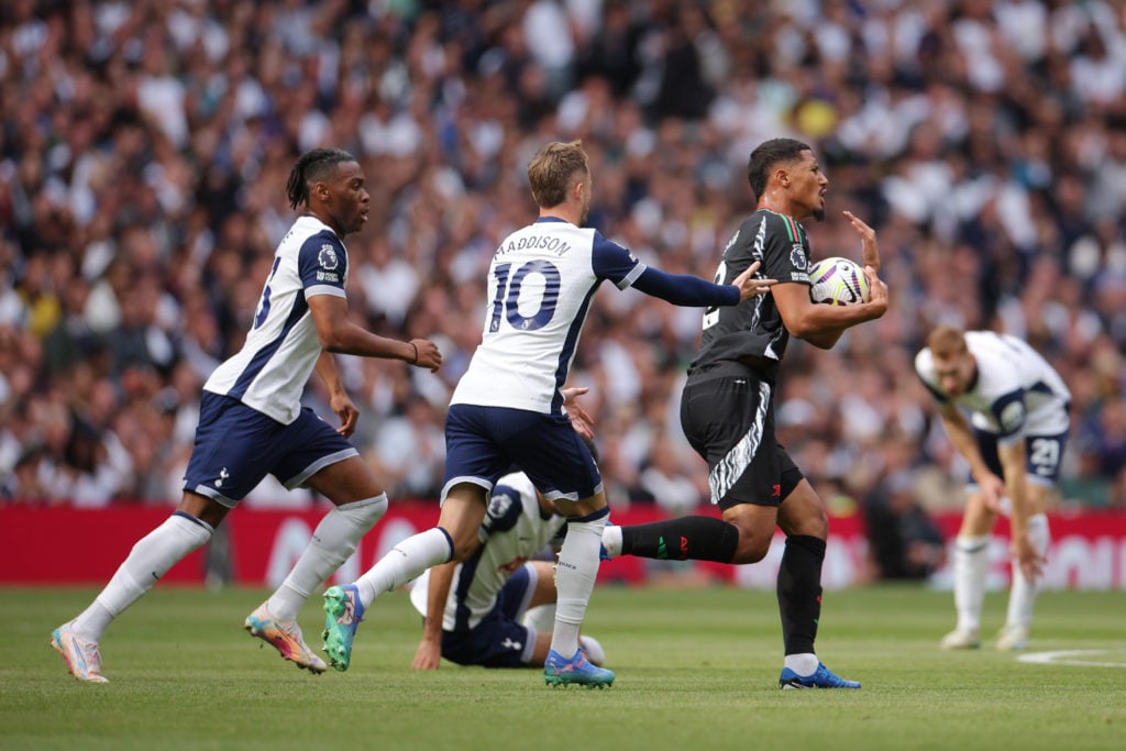 William Saliba of Arsenal clashes with James Maddison and Destiny Udogie of Tottenham Hotspur during the Premier League match between Tottenham Hot...