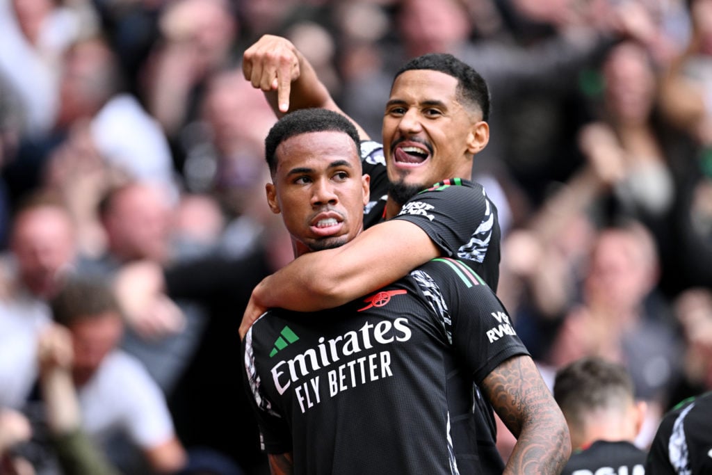 Gabriel of Arsenal celebrates scoring his team's first goal with teammate William Saliba during the Premier League match between Tottenham Hotspur ...