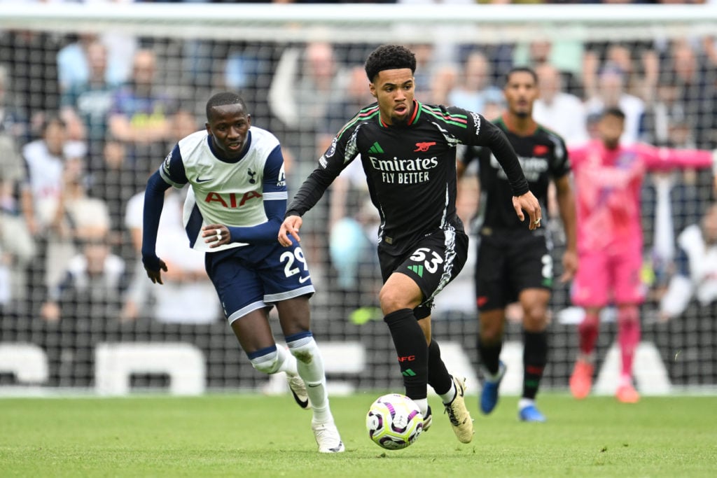 Ethan Nwaneri of Arsenal runs with the ball during the Premier League match between Tottenham Hotspur FC and Arsenal FC at Tottenham Hotspur Stadiu...