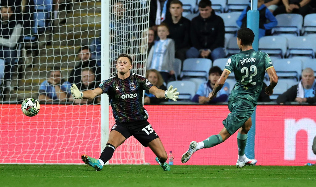 Brennan Johnson of Tottenham Hotspur puts the ball past Coventry City goalkeeper Ben Wilson to score their late match winning goal during the Carab...