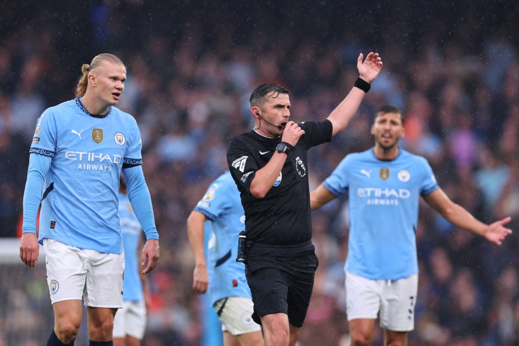 Erling Haaland of Manchester City reacts towards Referee Michael Oliver during the Premier League match between Manchester City FC and Arsenal FC a...