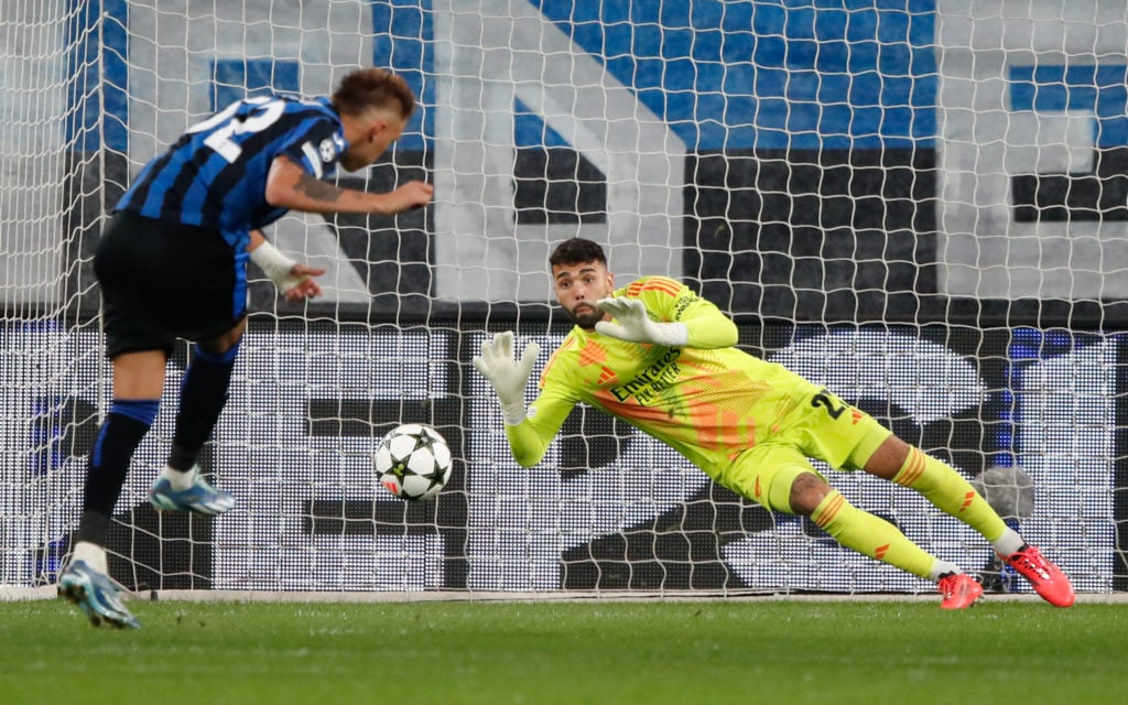 David Raya of Arsenal saves a penalty taken by Mateo Retegui of Atalanta during the UEFA Champions League 2024/25 League Phase MD1 match between At...