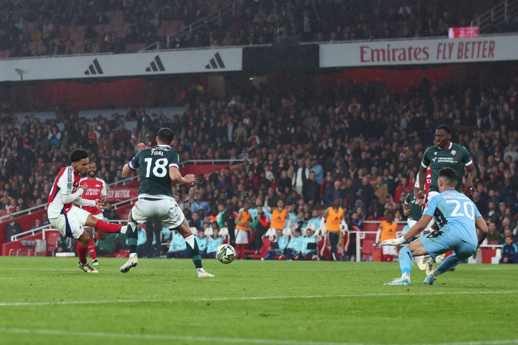 Ethan Nwaneri of Arsenal scores the third goal  during the Carabao Cup Third Round match between Arsenal and Bolton Wanderers at Emirates Stadium o...