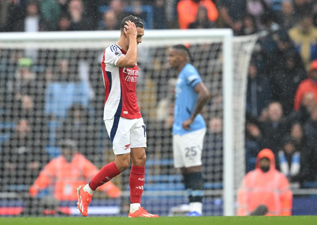 Leandro Trossard of Arsenal leaves the pitch after being shown a red card during the Premier League match between Manchester City FC and Arsenal FC...