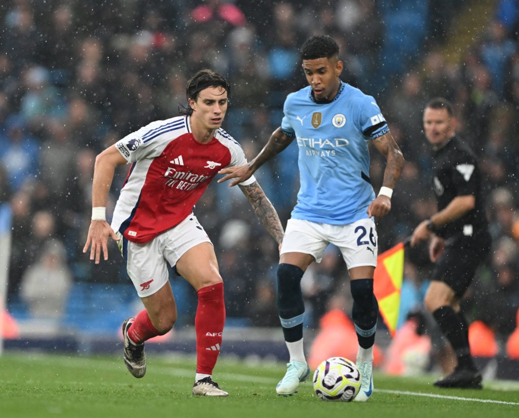 Riccardo Calafiori of Arsenal closes down Savinho of Man City during the Premier League match between Manchester City FC and Arsenal FC at Etihad S...