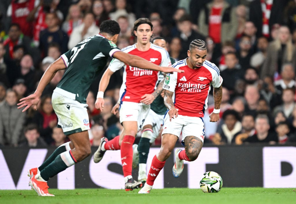 Gabriel Jesus of Arsenal runs with the ball under pressure from Chris Forino of Bolton Wanderers during the Carabao Cup Third Round match between A...