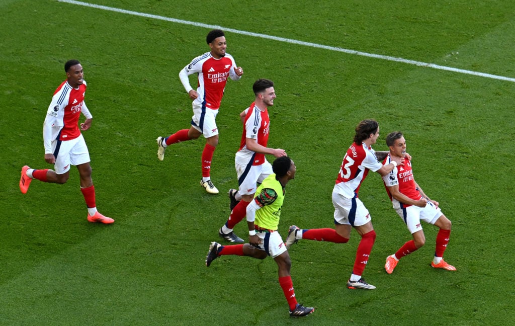 Leandro Trossard of Arsenal celebrates with teammates after scoring his team's third goal during the Premier League match between Arsenal FC and Le...