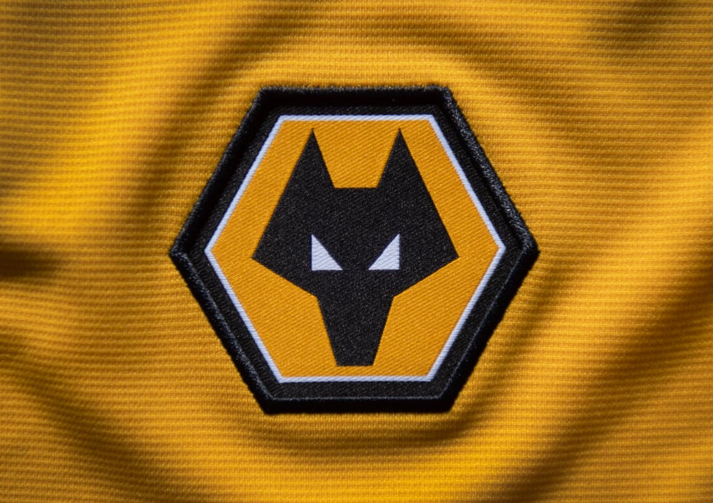 The official Wolverhampton Wanderers FC club badge on a home shirt on May 3, 2023 in Manchester, United Kingdom.