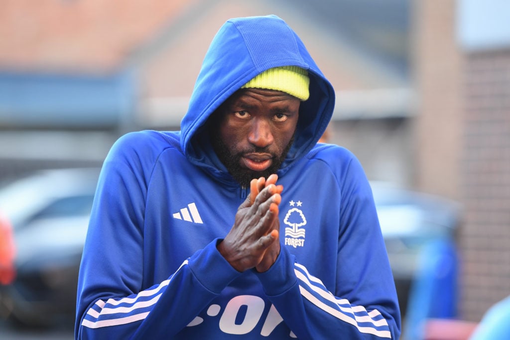 Cheikhou Kouyate of Nottingham Forest is feeling the cold during the Premier League match between Nottingham Forest and Brighton and Hove Albion at...