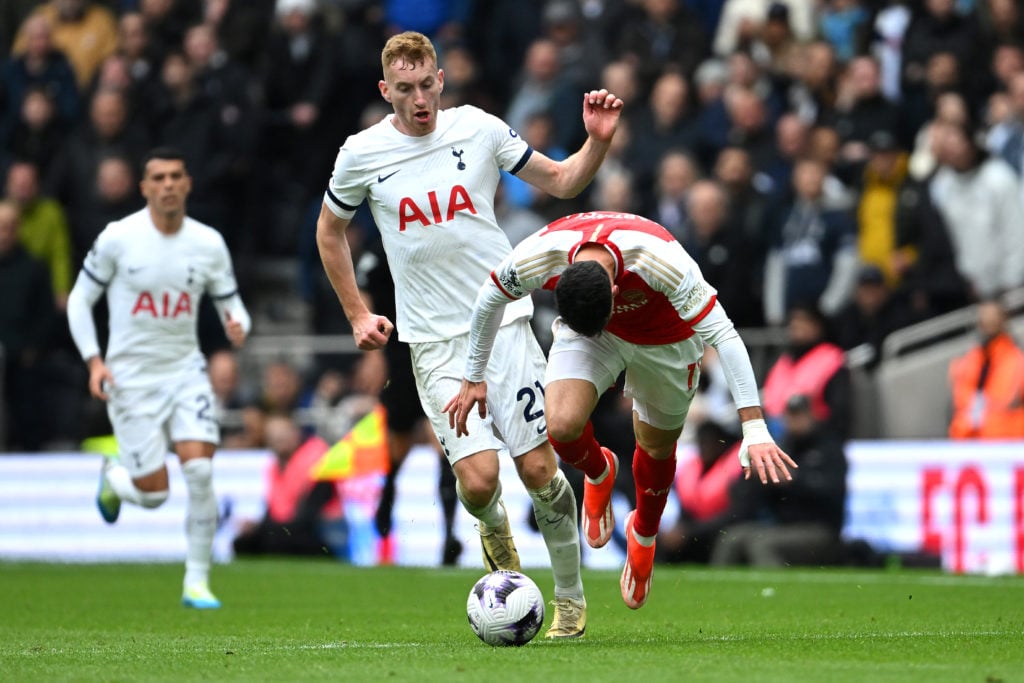 Gabriel Martinelli of Arsenal is challenged by Dejan Kulusevski of Tottenham Hotspur during the Premier League match between Tottenham Hotspur and ...