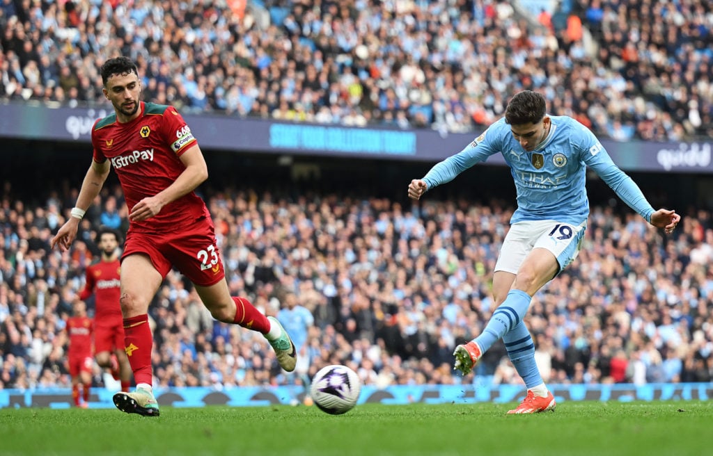 Julian Alvarez of Manchester City scores his team's fifth goal during the Premier League match between Manchester City and Wolverhampton Wanderers ...